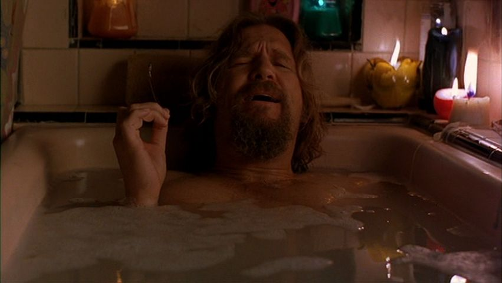 Screen clip of the Dude from The Big Lebowski movie in the tub having a moment of good news knowing his car has been found.
